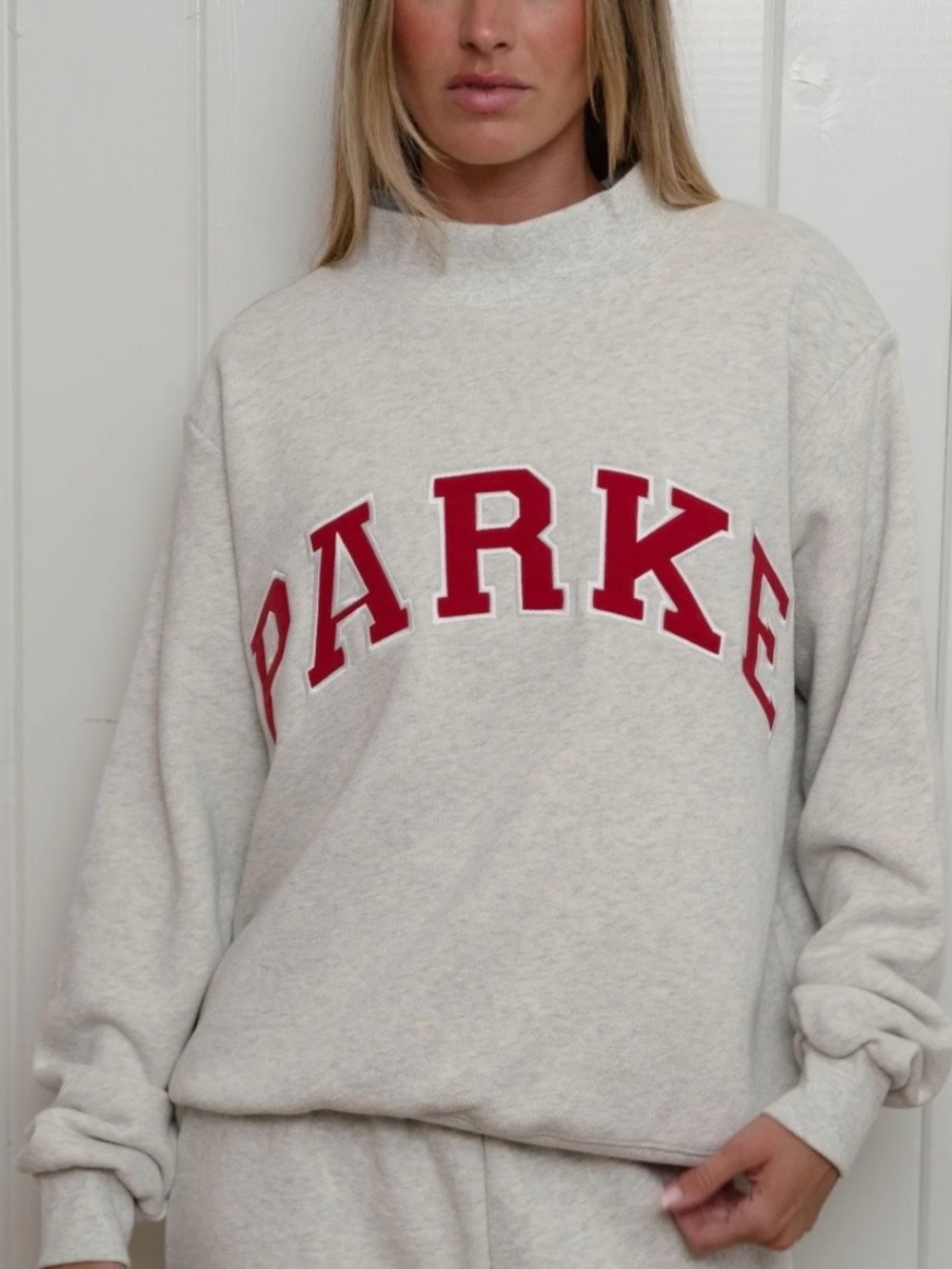 Parker Cream Crewneck Sweatshirt with Red Lettering.Size L/XL